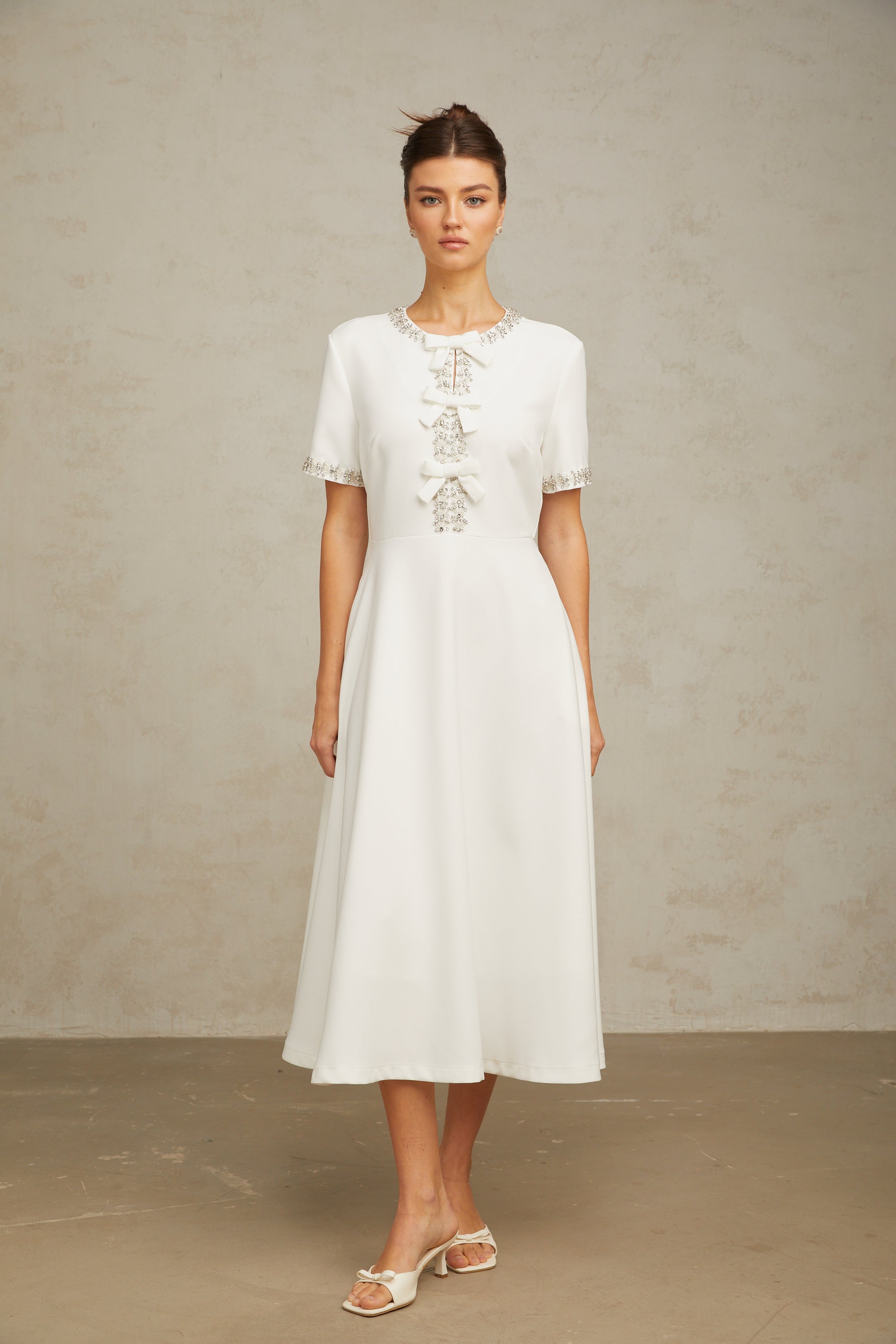 Cassiopeia crystal-accented bow midi dress in White