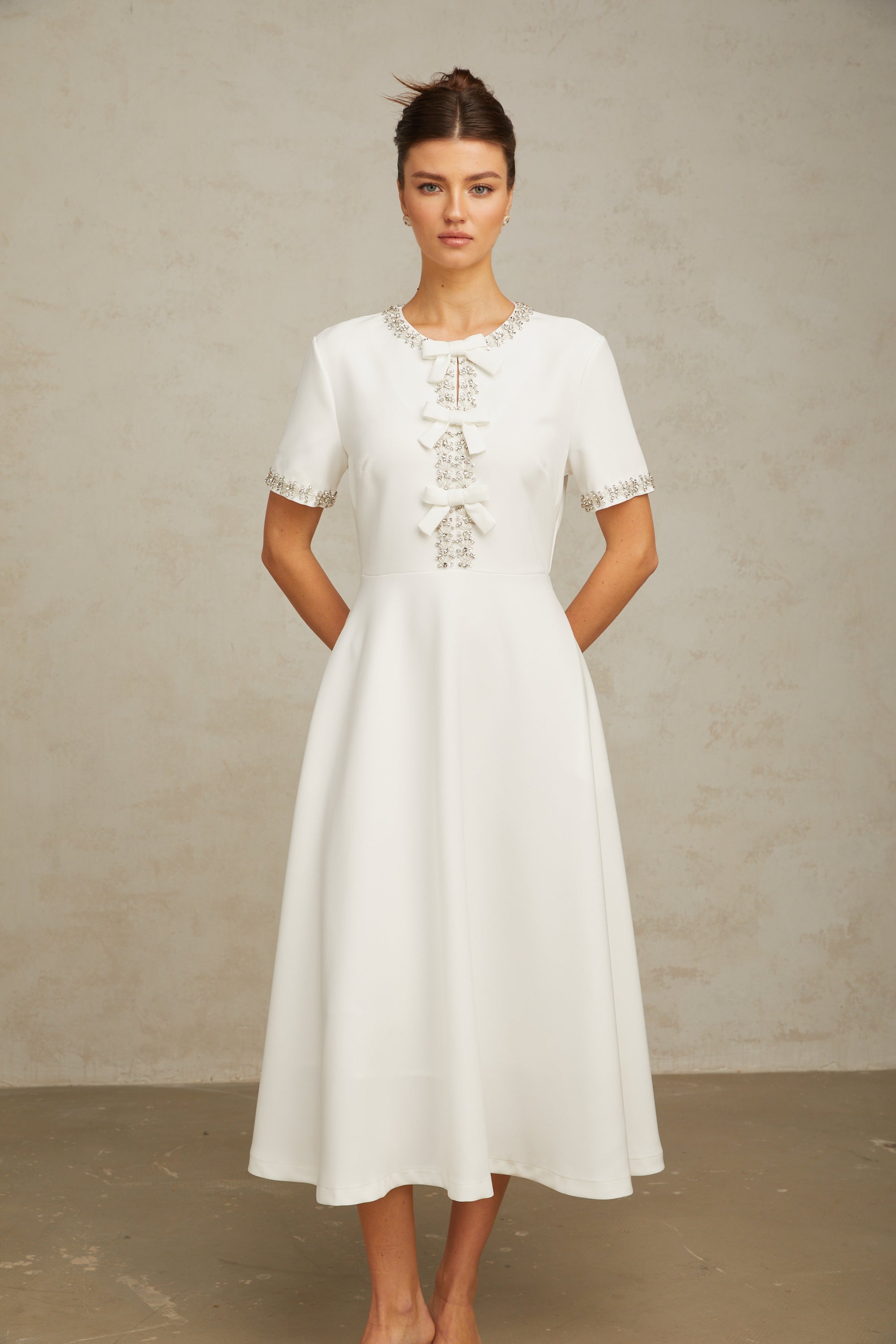 Cassiopeia crystal-accented bow midi dress in White