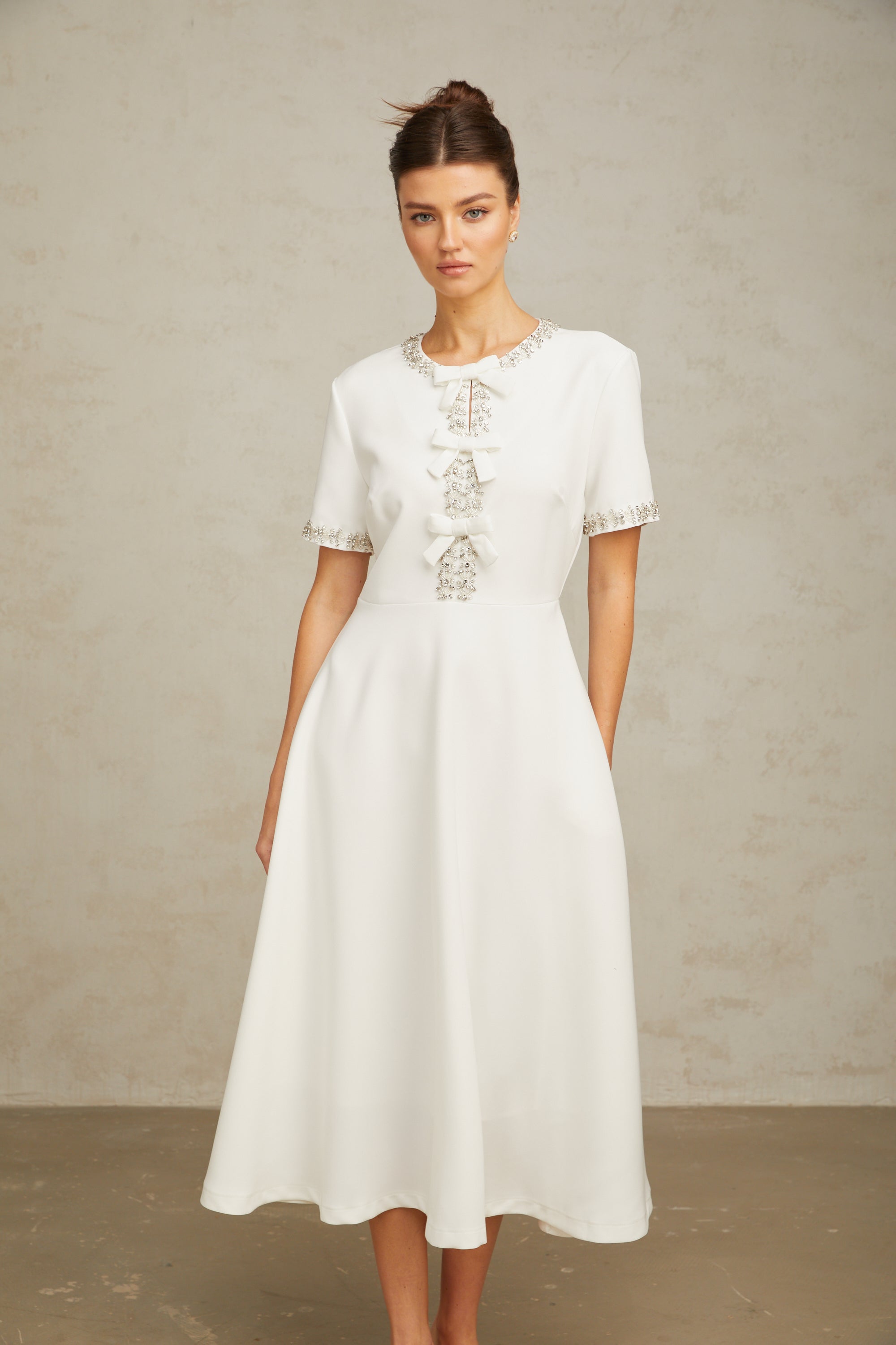 Cassiopeia crystal-accented bow midi dress in White