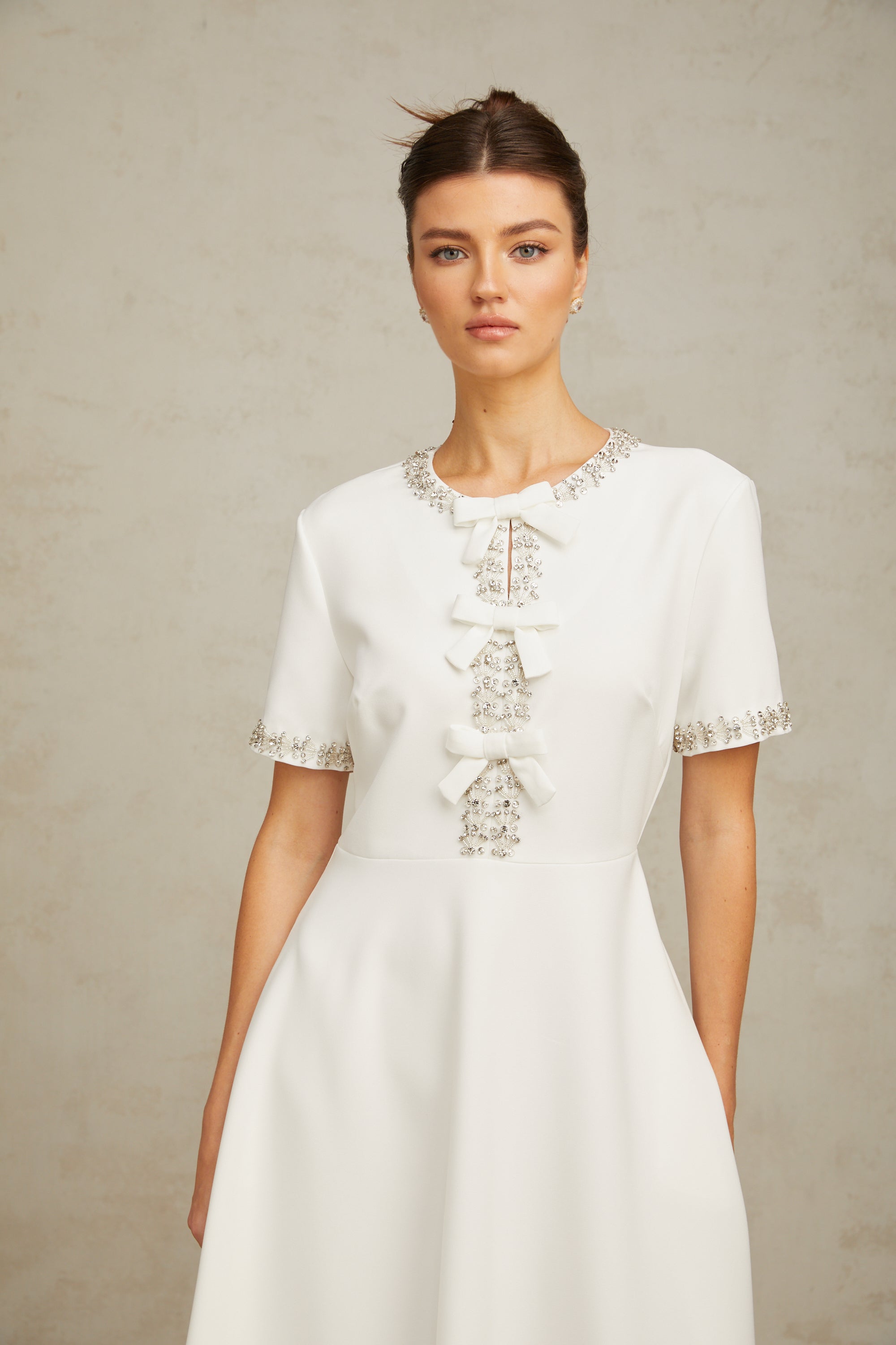 Cassiopeia crystal-accented bow midi dress in White