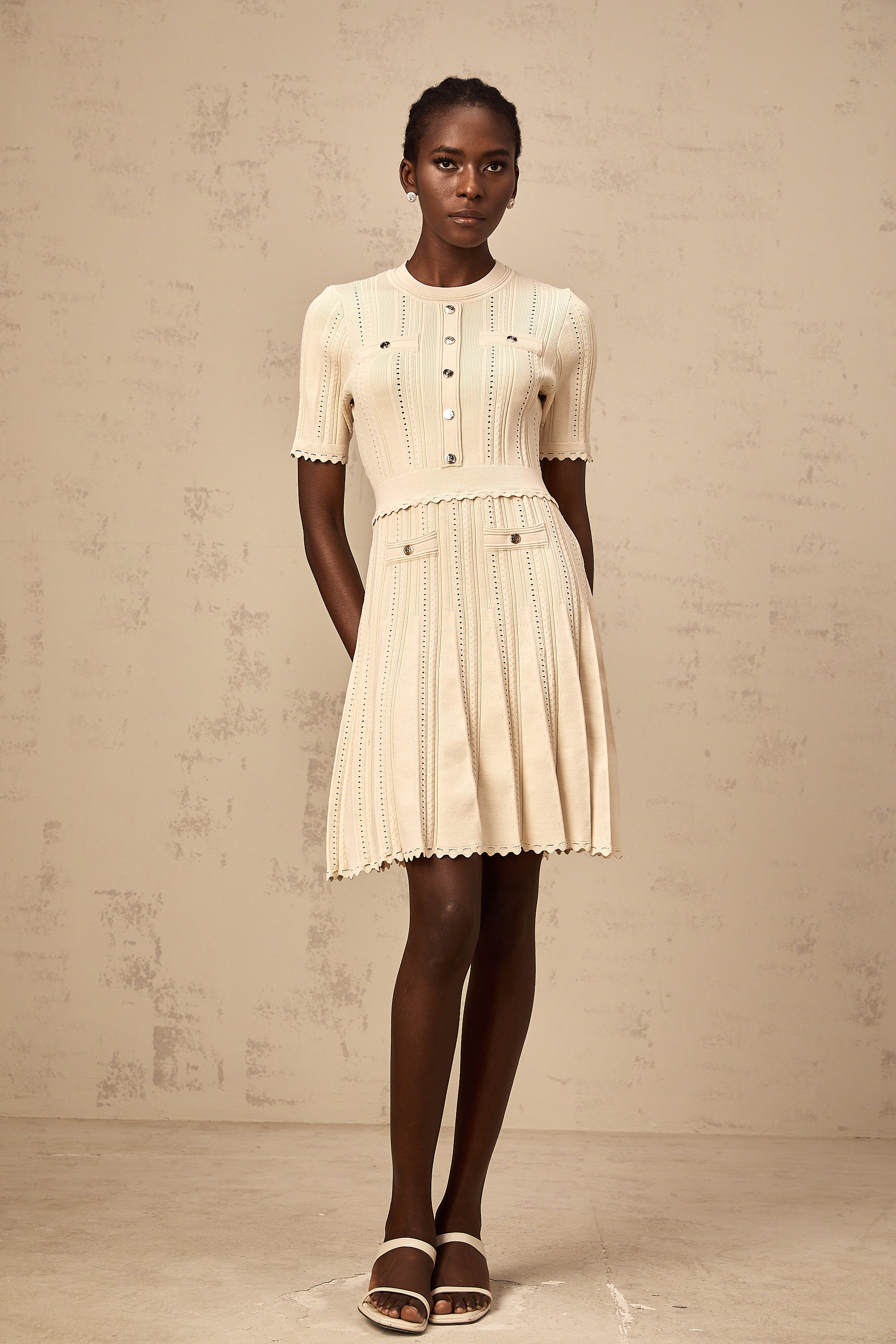 Amélie neutrals pointelle-trim pleated knit mini dress