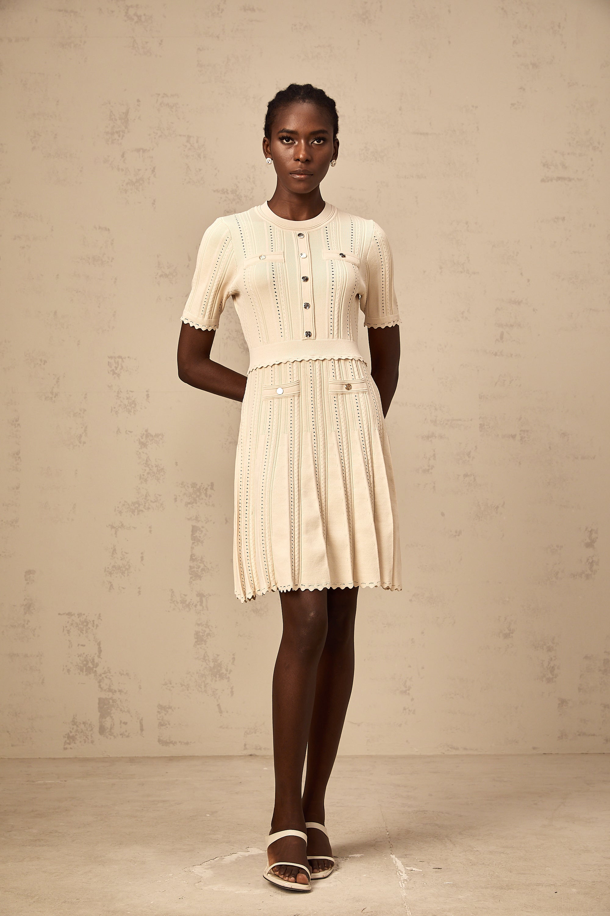 Amélie neutrals pointelle-trim pleated knit mini dress