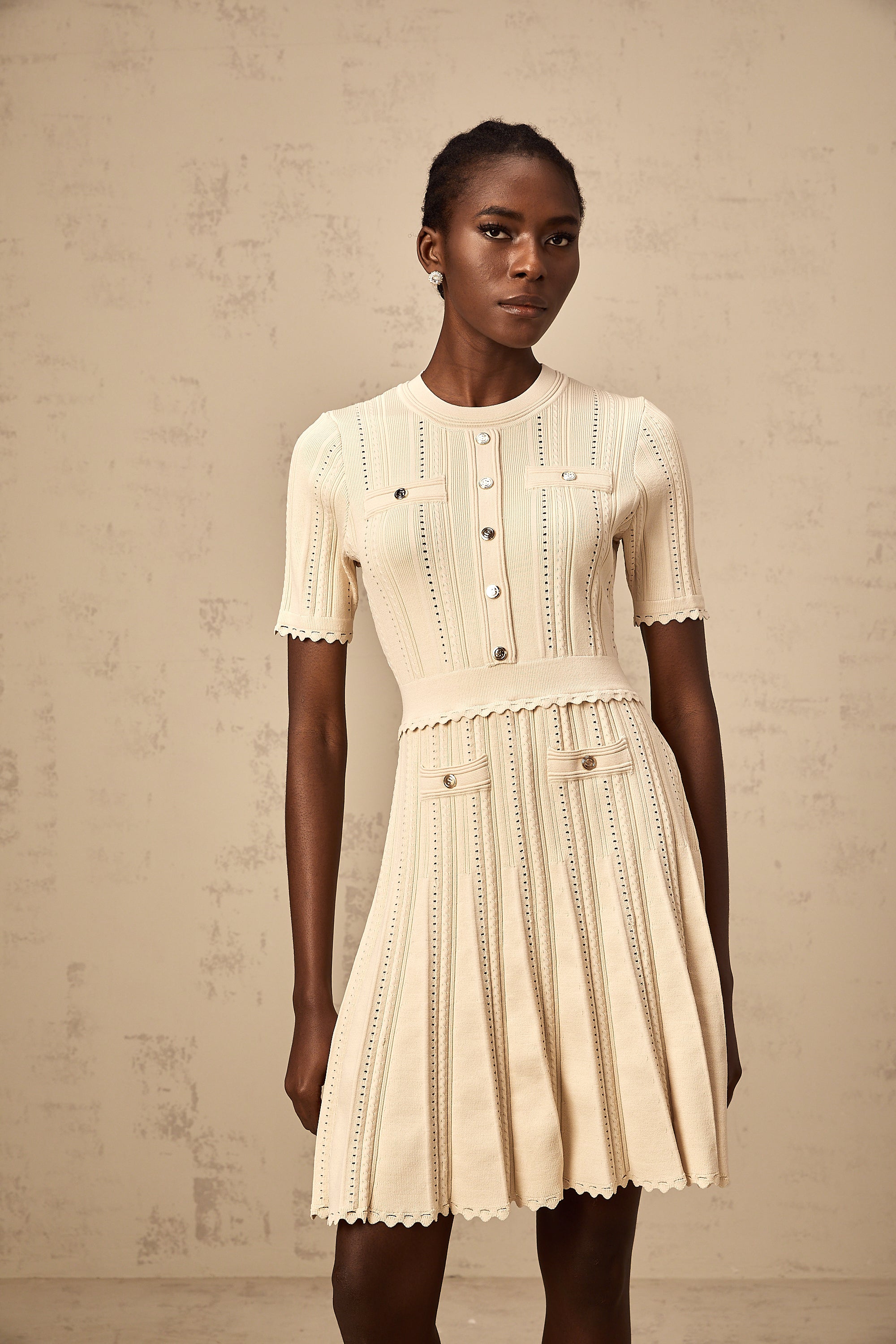Amélie neutrals pointelle-trim pleated knit mini dress