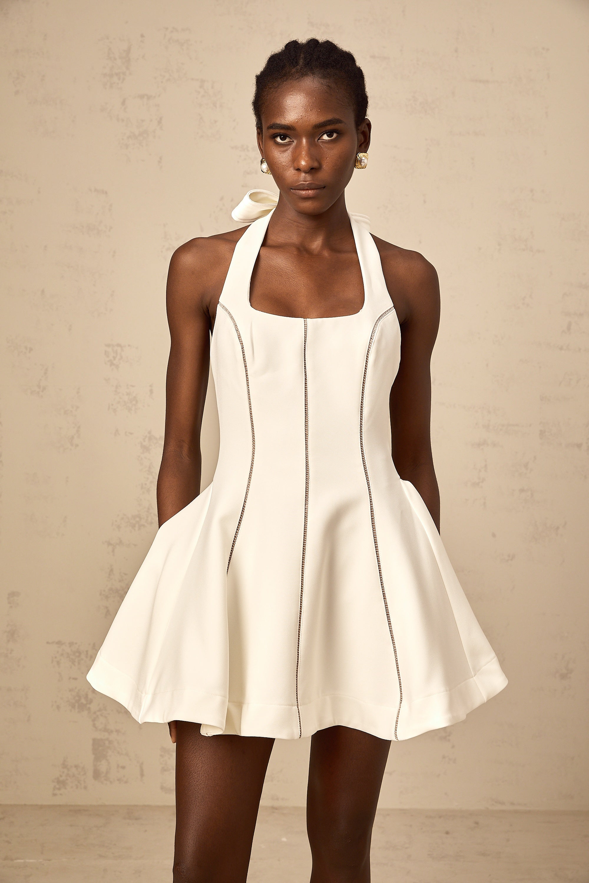 Quirine halterneck bow-detail mini dress in White