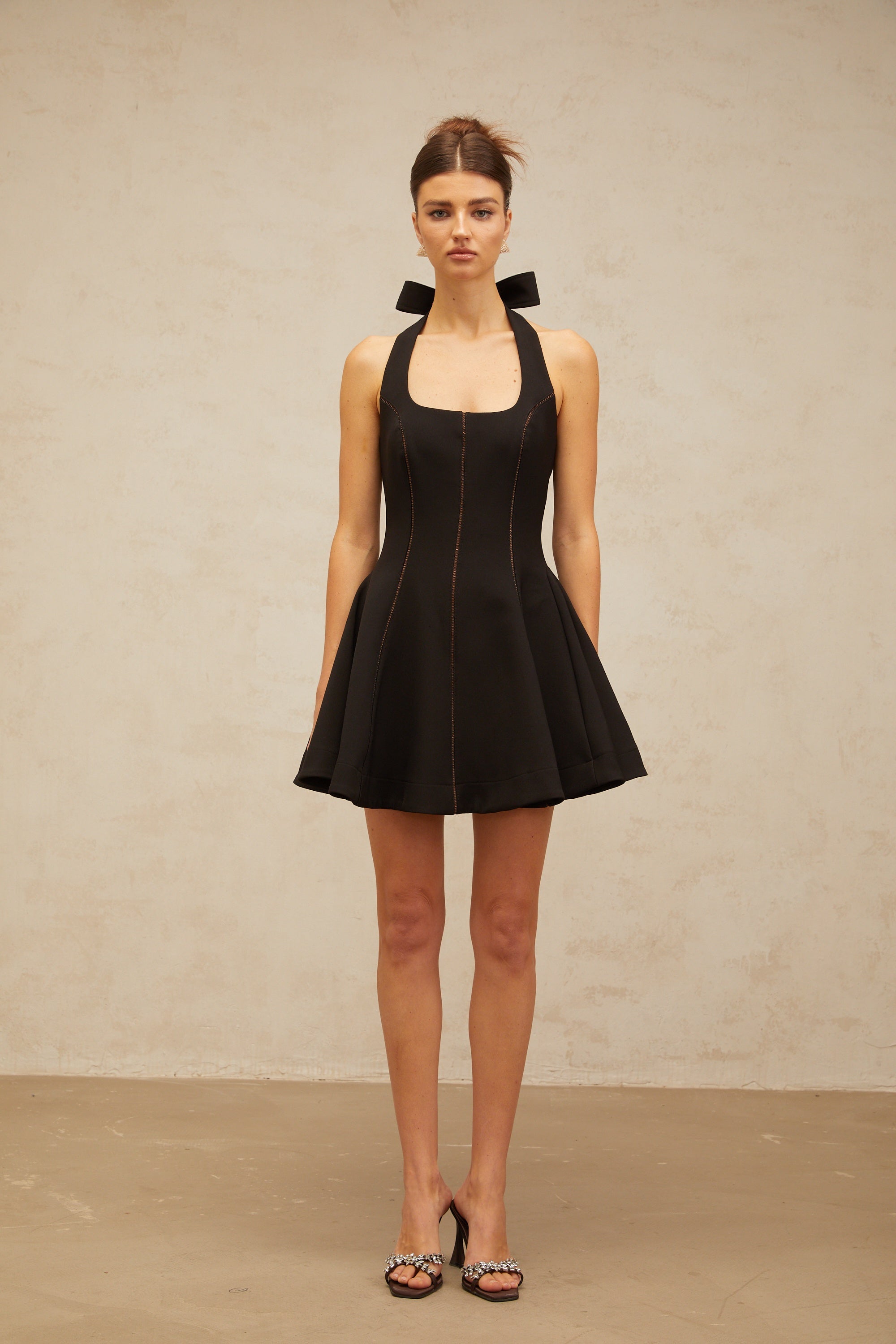 Quirine halterneck bow-detail mini dress in Black