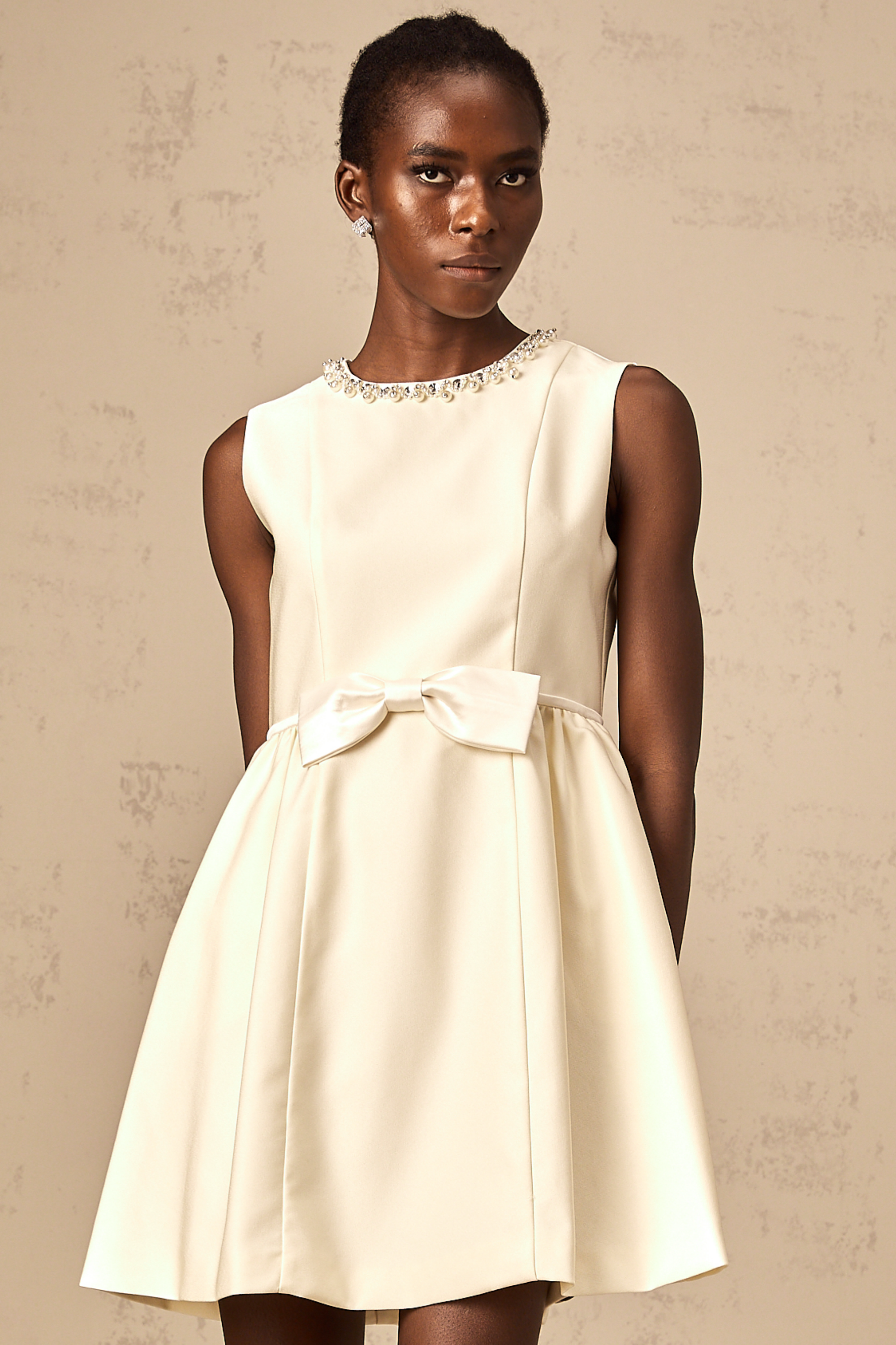 Isabelle white bowknot embellished mini dress