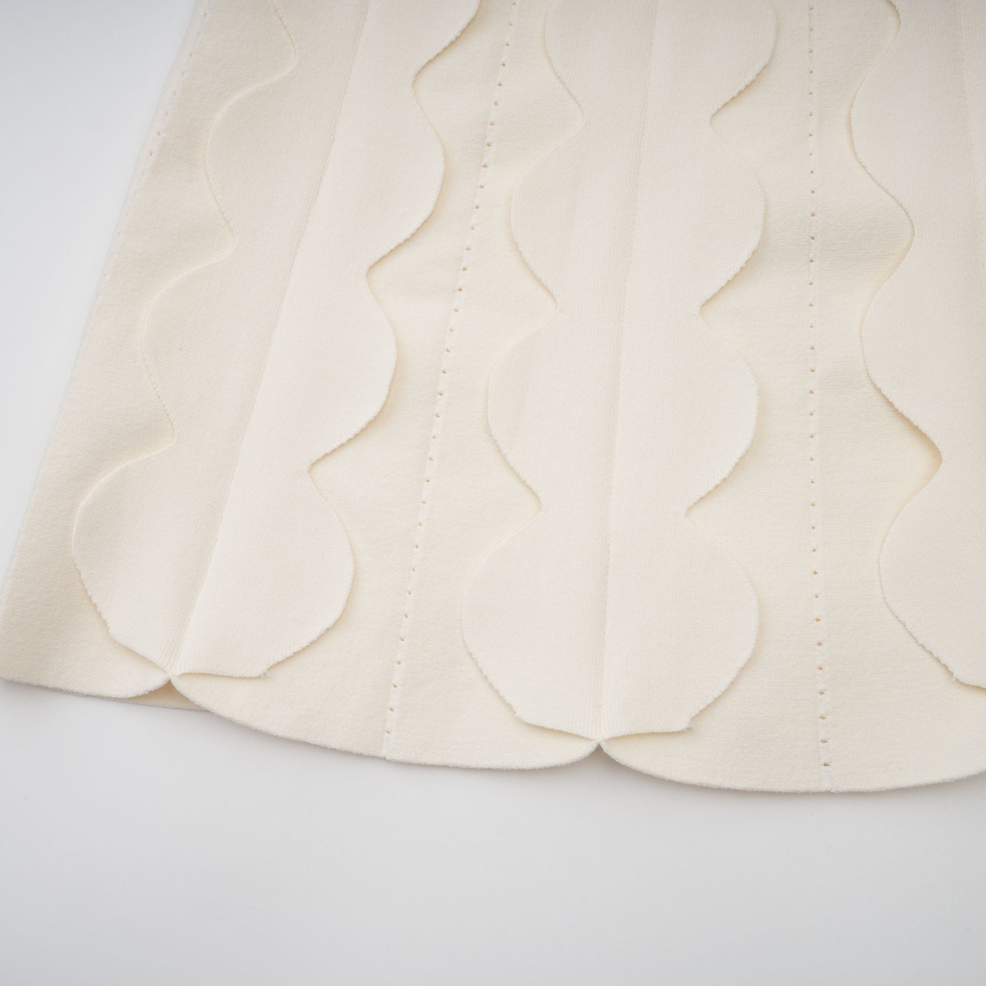Axelle white wavy-detail sleeveless mini dress