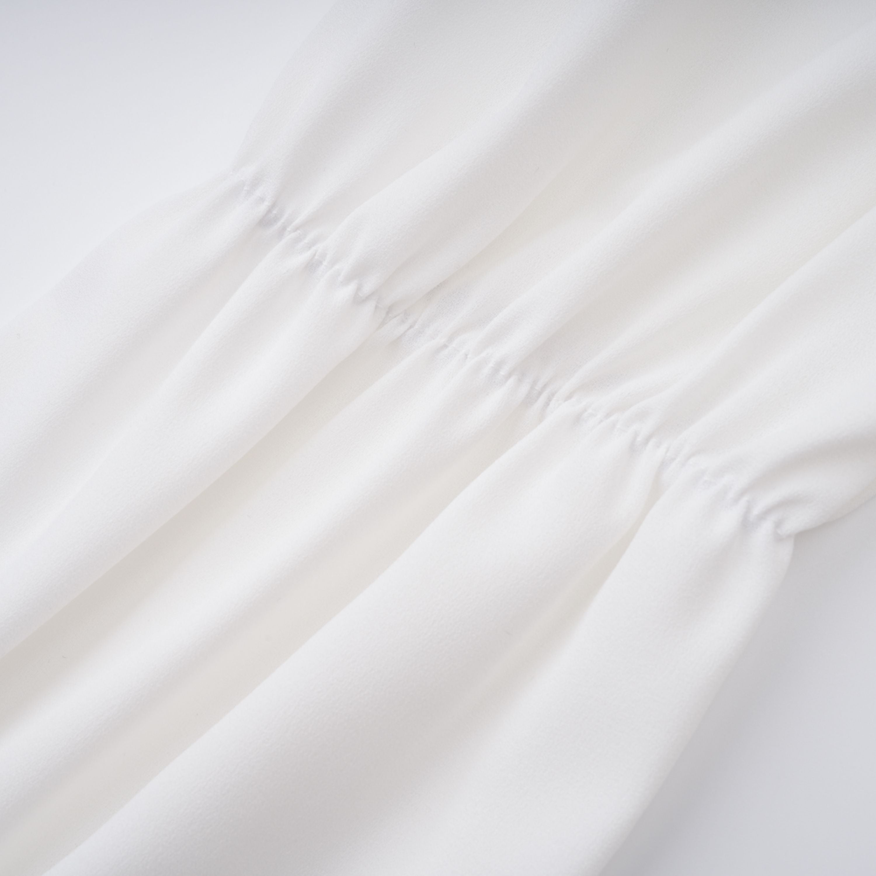 Paulette white bowknot shirred-panel ruffled shirt